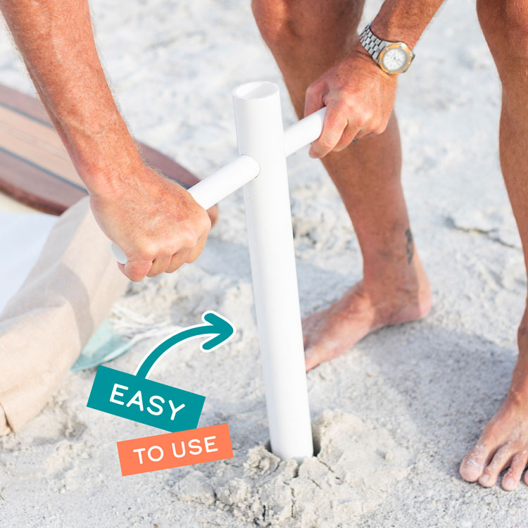 A close up of a man at the beach screwing the Suncoast Beach Shade umbrella anchor into the sand with the words "Easy to Use" on top of the image